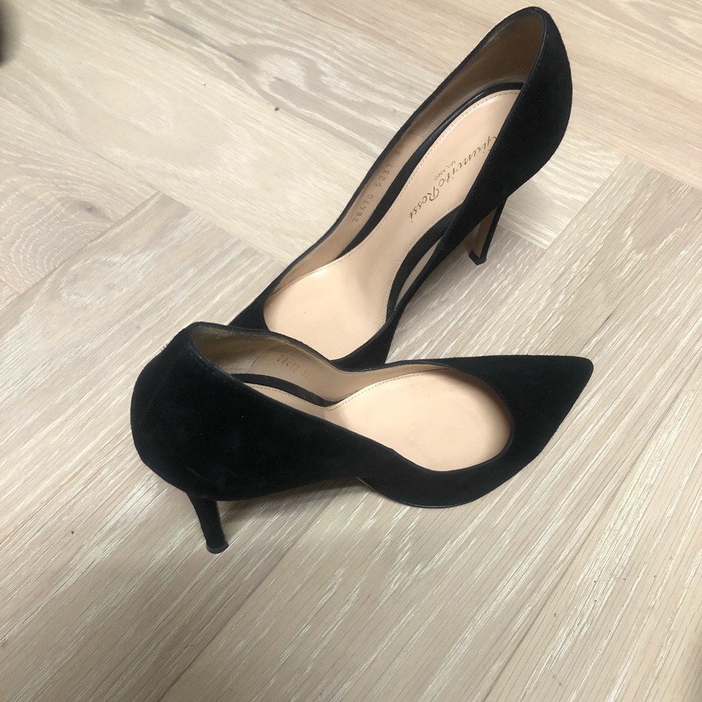 Black suede closed toe high heels.